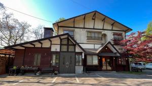 a large house with a gambrel roof at irodori in Matsumoto