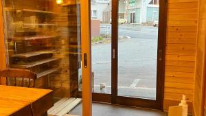 a sliding glass door with a view of a street at irodori in Matsumoto