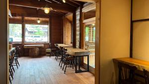 a row of tables and chairs in a restaurant at irodori in Matsumoto
