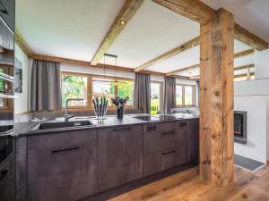 a kitchen with a sink and a counter at Chalet Bodahof in Aschau