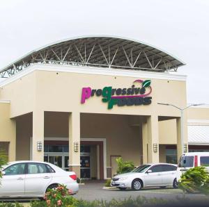 a shopping center with cars parked in front of it at Portmore - Cheerful Private Bedroom with Fan only or AC - Choose your room in Portmore