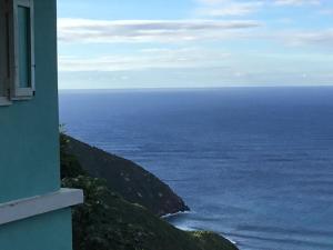 a view of the ocean from a building at Abigail's Spectacular 2 bedrooms-Entire Apartment in Tortola Island