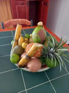 a plate of fruits and vegetables on a table at Villa VICTORIA in Le Lamentin +7 photos