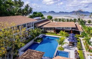an aerial view of a resort with a swimming pool and the beach at Ora Beach Resort in El Nido