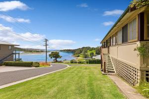 a house with a view of the water at The Seamist Cottage in Narooma