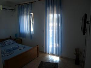 Postel nebo postele na pokoji v ubytování Friendly House