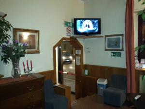 TV a/nebo společenská místnost v ubytování Albergo Sonia