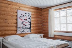 מיטה או מיטות בחדר ב-Holiday in Lapland - Levisalmi A