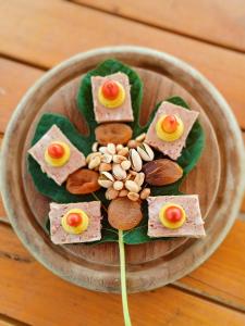 a plate of food with crackers and nuts at KAMENGRAD CUPICA in Danilovgrad