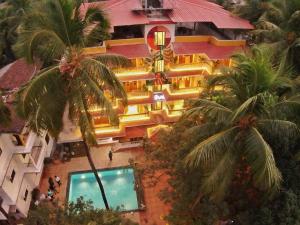 an overhead view of a building with a swimming pool at Olive Calangute Niwasa - by Embassy Group in Calangute