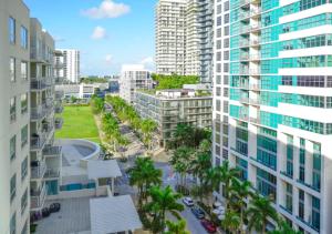 an aerial view of a city with tall buildings at Two Bedroom Apartment with Pool At Midblock Miami in Miami