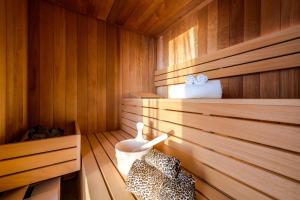 a sauna with wooden paneled walls and a wooden floor at Villa Panorama in Crikvenica +34 photos