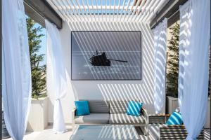 a patio with a bench and a picture of a helicopter at Villa Panorama in Crikvenica