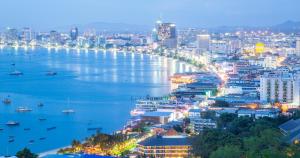 a view of a city and a river at night at Sailor Hotel Pattaya in Pattaya South