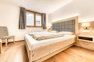 Ένα ή περισσότερα κρεβάτια σε δωμάτιο στο Appartements im Kirchberg by A-Appartments
