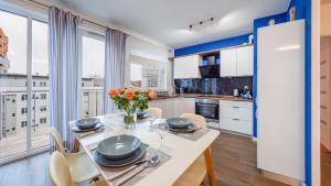 Kuchyňa alebo kuchynka v ubytovaní Apartamenty Sun&Snow Marina Primore