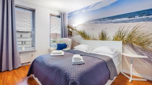 Posteľ alebo postele v izbe v ubytovaní Apartamenty Sun&Snow Marina Primore