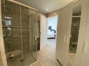 a bathroom with a shower and a glass shower stall at Residence 4T - 33 Avenue Gaston Chauvin in Aulnay-sous-Bois