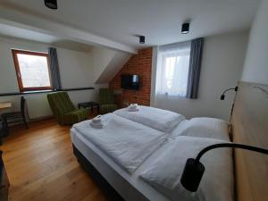 Postel nebo postele na pokoji v ubytování Apartmány Resort Na Horské