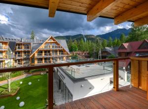 a view from the balcony of a resort at VisitZakopane - Royal Resort Wellness & SPA in Zakopane