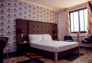 Postel nebo postele na pokoji v ubytování New Heaven Hôtel