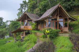 a house on the side of a hill at Yeh Baat Jatiluwih by The Lavana in Jatiluwih