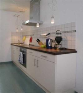 Virtuvė arba virtuvėlė apgyvendinimo įstaigoje Strandvilla _ Lubmin