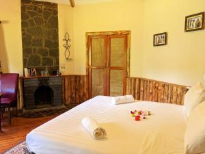 Ένα ή περισσότερα κρεβάτια σε δωμάτιο στο Lawns Hotel +91 φωτογραφίες