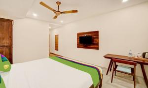 Ένα ή περισσότερα κρεβάτια σε δωμάτιο στο Treebo Lazystay Elite