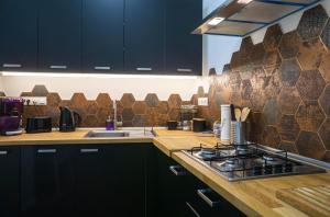 Kuchyňa alebo kuchynka v ubytovaní Cosy Casa + 27 fotografií