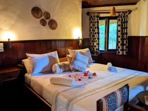 a bedroom with a large bed with flowers on it at Lawns Hotel in Lushoto