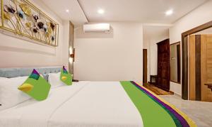Ένα ή περισσότερα κρεβάτια σε δωμάτιο στο Treebo Lazystay Elite