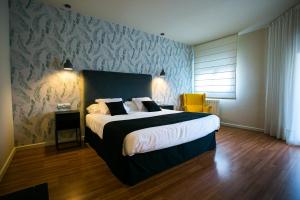Łóżko lub łóżka w pokoju w obiekcie Hotel Spa Sinagoga