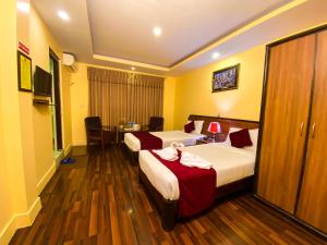Krevet ili kreveti u jedinici u okviru objekta Thamel Grand Hotel