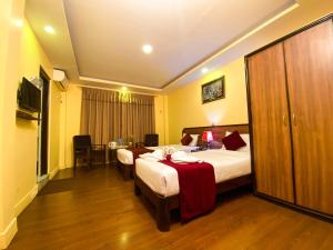 Krevet ili kreveti u jedinici u okviru objekta Thamel Grand Hotel