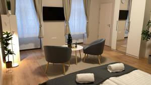 Televízia a/alebo spoločenská miestnosť v ubytovaní Urban Spirit 2 Apartment