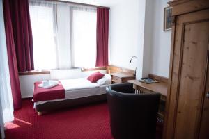 Postel nebo postele na pokoji v ubytování Hotel Jelinek