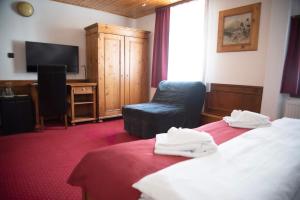 Postel nebo postele na pokoji v ubytování Hotel Jelinek