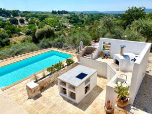 The swimming pool at or close to Trullo Falco