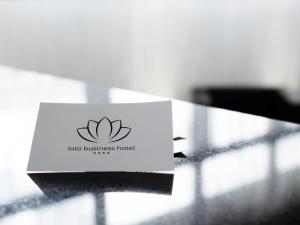 a card sitting on top of a table at Loto Business Hotel in Rome