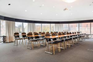 a conference room with tables and chairs and windows at Best Western Tidbloms Hotel in Gothenburg