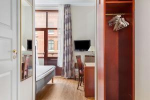 TV a/nebo společenská místnost v ubytování Best Western Tidbloms Hotel