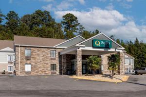 a hotel with a sign on the front of it at Quality Inn Phenix City Columbus in Phenix City