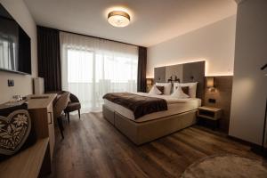Postel nebo postele na pokoji v ubytování Freina Mountain Lifestyle Hotel
