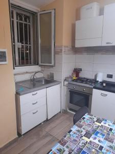 a small kitchen with a sink and a stove at Apt B.H rome (piazza bologna square ) in Rome