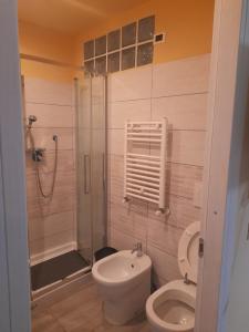 a bathroom with a toilet and a shower at Apt B.H rome (piazza bologna square ) in Rome