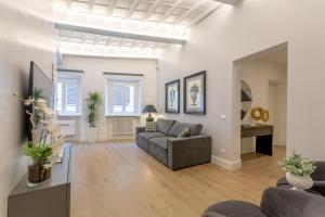 a living room with a couch and a table at Diva Lodging Luxury - Signoria in Florence