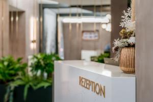 a reception desk in an office with plants at Brüngers Landhaus in Rödinghausen