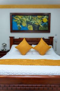 Postel nebo postele na pokoji v ubytování Hotel Aires del Quindío Armenia