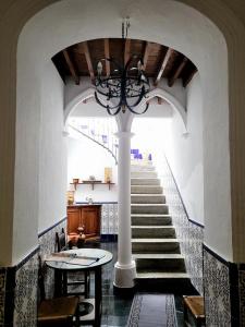 a staircase in a building with a chandelier at Villa Alegria in Gérgal